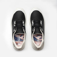 Black sneakers with a colorful sole on a white background sell at Paradise Golf