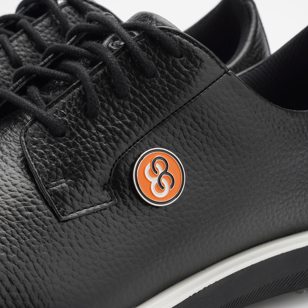 Black leather shoe with a logo on a white background sells at Paradise Golf
