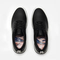 Black sneakers with a visible brand logo on a white background sells at Paradise Golf