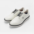 White sneakers with black laces and a sole on a light gray background sells at Paradise Golf