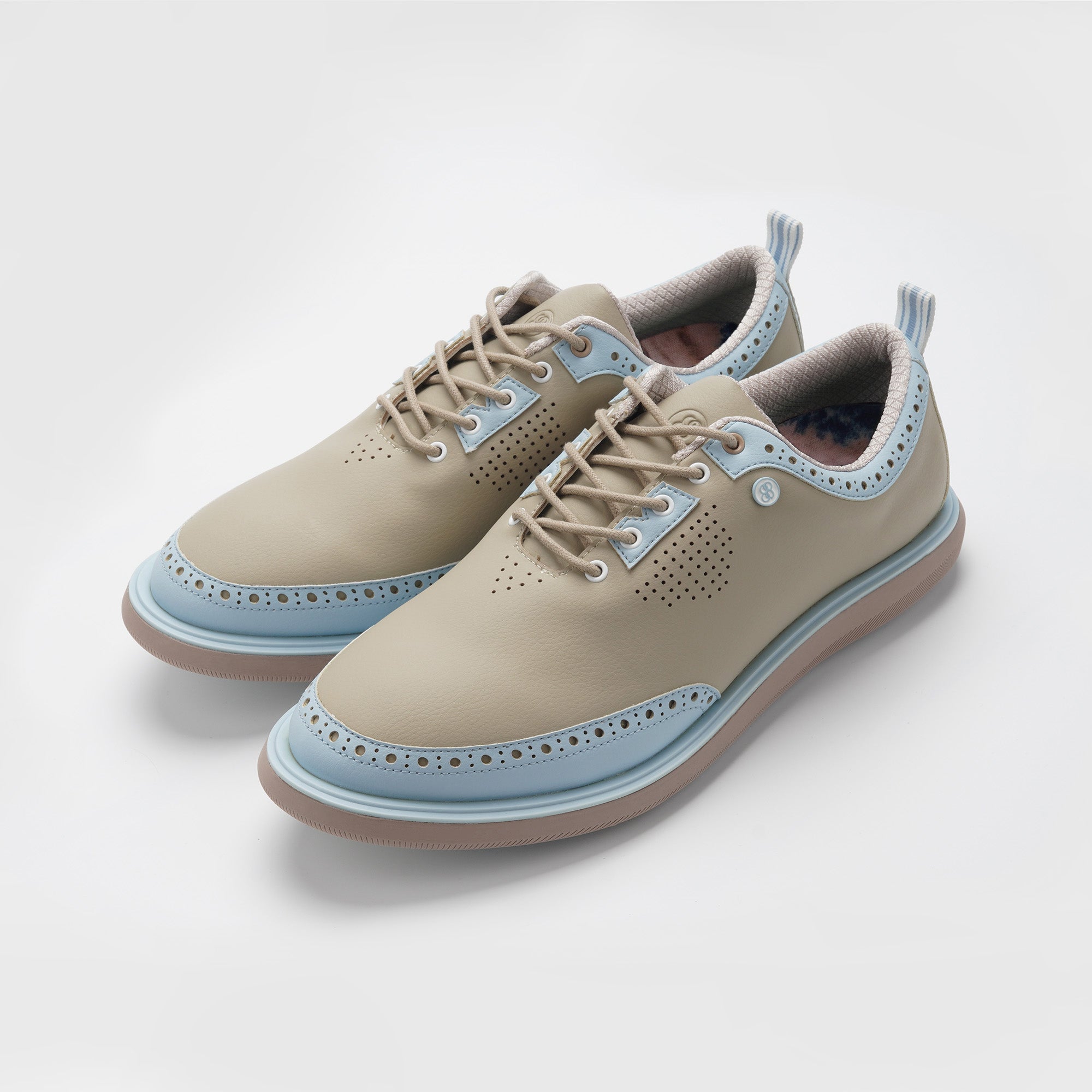 Beige and light blue shoes on a white background sell at Paradise Golf