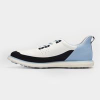 White, black, and blue athletic shoe on a light gray background sells at Paradise Golf