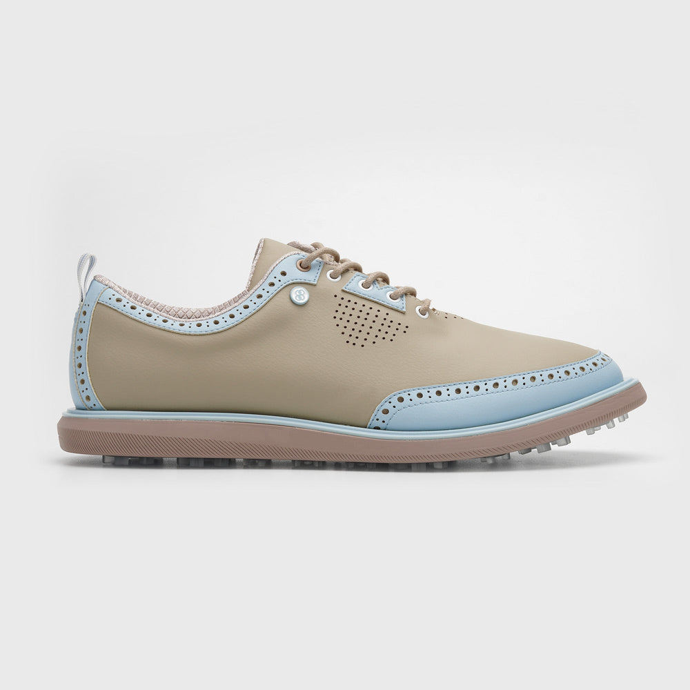 Beige and light blue shoe on a white background sells at Paradise Golf