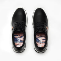 Black sneakers with colorful sole patterns on a white background sells at Paradise Golf