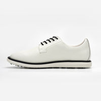 White sneaker with black accents on a white background sells at Paradise Golf