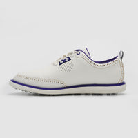 White golf shoe with purple accents on a light gray background sells at Paradise Golf