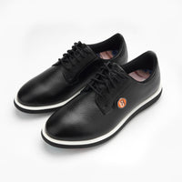 A pair of black leather shoes with a brand logo on a white background sells at Paradise Golf