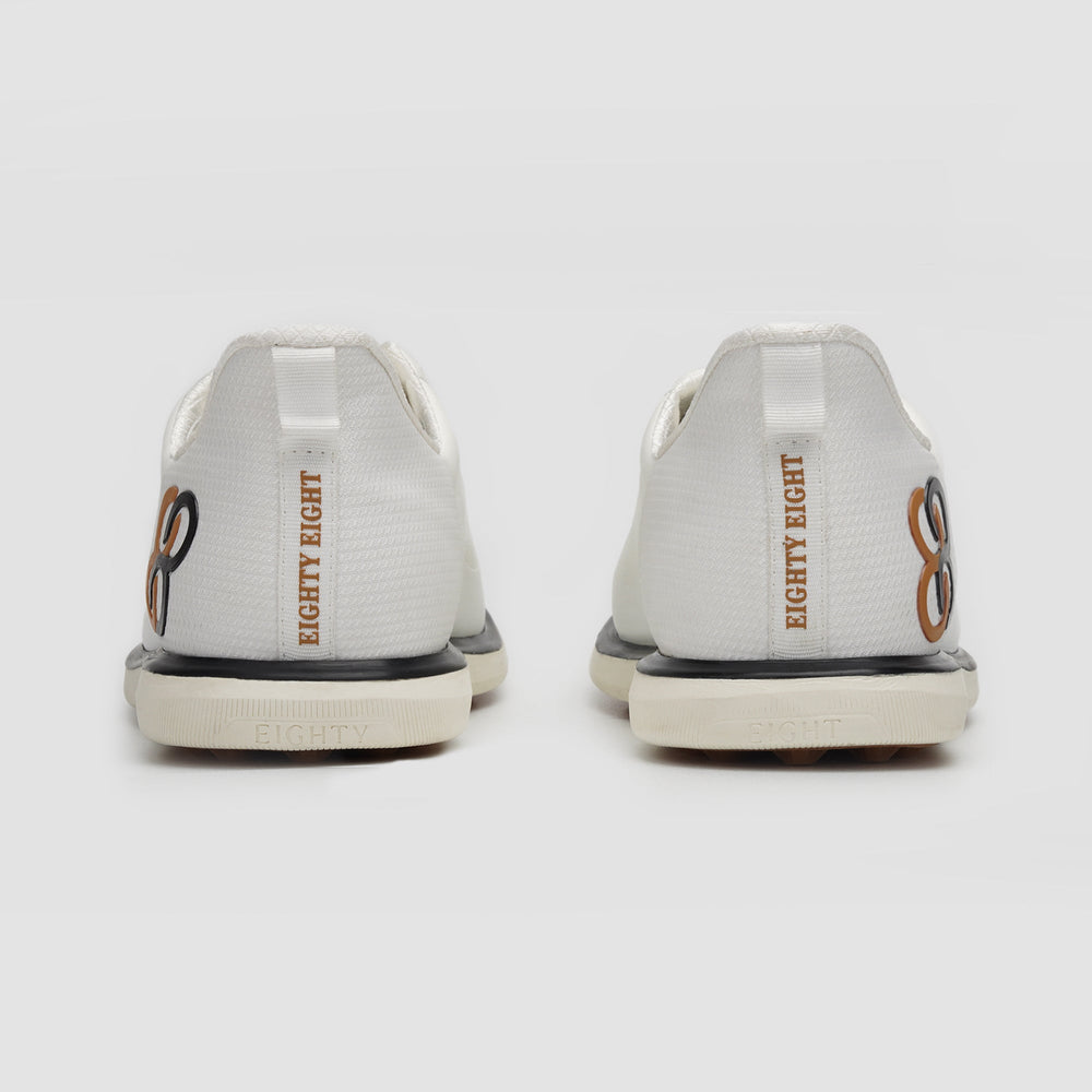 White sneakers with 'EIGHTY EIGHT' branding on a light gray background sells at Paradise Golf