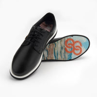 Black leather shoe with a colorful sole on a white background sells at Paradise Golf