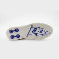 White shoe sole with blue designs on a white background sells at Paradise Golf