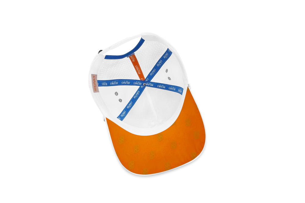 Cap with white top and orange bottom on a white background sells at Paradise Golf