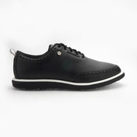 Black leather shoe with white sole on a white background sells at Paradise Golf
