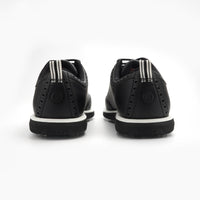 Black shoes with white soles on a white background sells at Paradise Golf