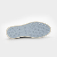 Close-up of a shoe sole with a textured pattern on a white background sells at Paradise Golf