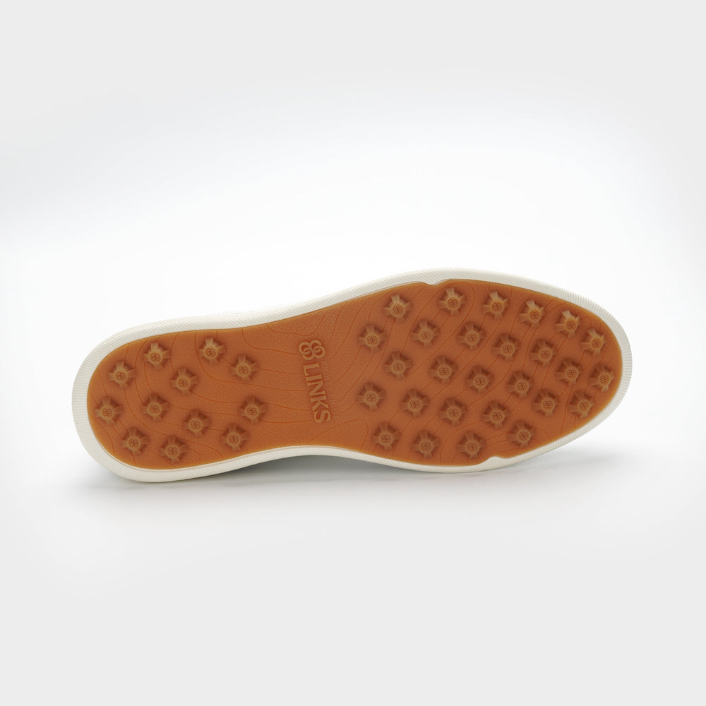 Brown sole of a shoe with a brand logo on a white background sells at Paradise Golf