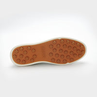 Brown sole of a shoe with a brand logo on a white background sells at Paradise Golf
