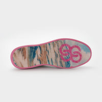 Sole of a shoe with a pink logo and a multicolored pattern on a white background sells at Paradise Golf