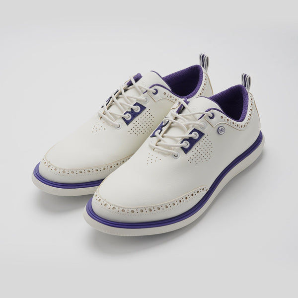 White shoes with purple accents on a light gray background sells at Paradise Golf