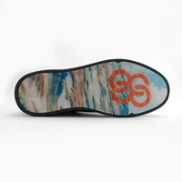 Shoe sole with an abstract pattern and an orange logo on a white background sells at Paradise Golf