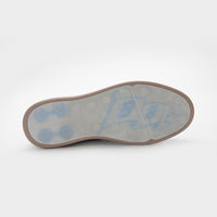 Shoe sole with blue arch support and brown border on a white background sells at Paradise Golf