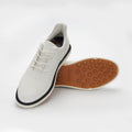 White sneaker with brown sole on a white background sells at Paradise Golf