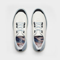 White sneakers with black accents on a light gray background sells at Paradise Golf