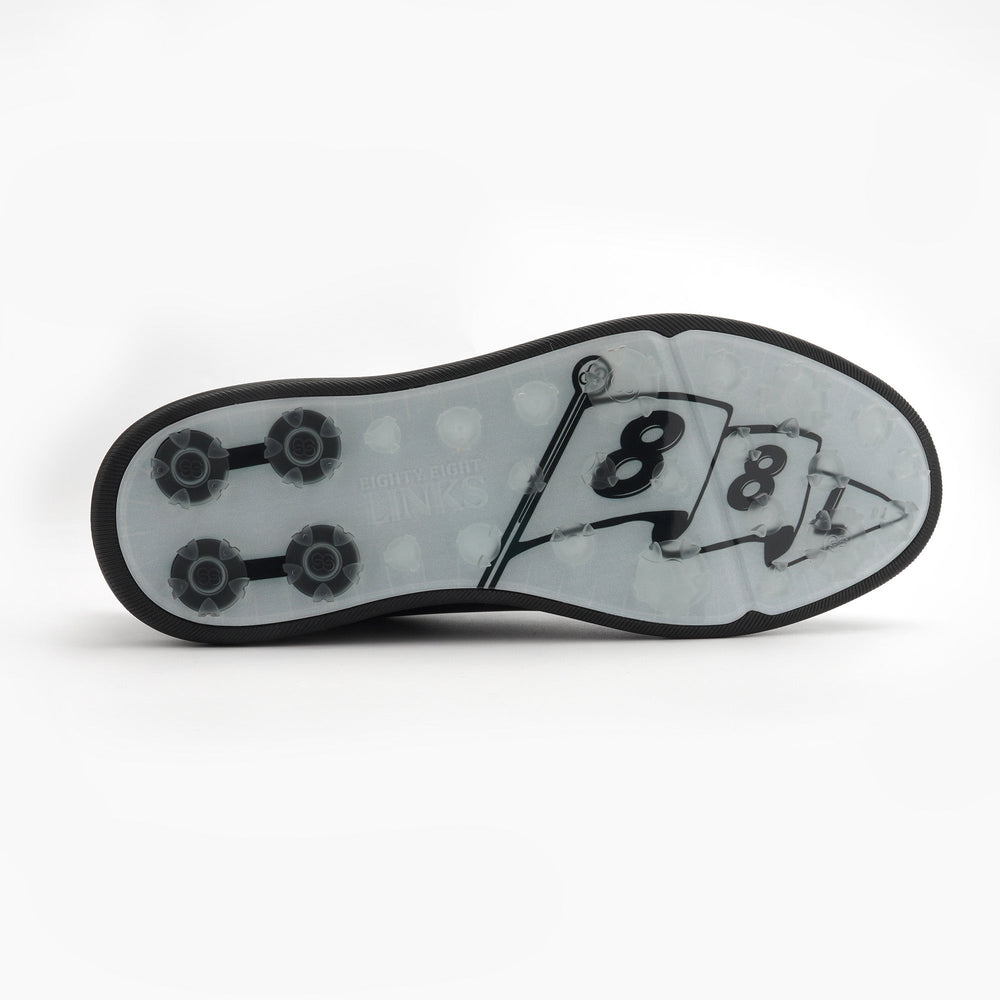 Close-up of a shoe sole with a number '8' design on a white background sells at Paradise Golf