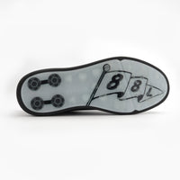 Close-up of a shoe sole with a number '8' design on a white background sells at Paradise Golf