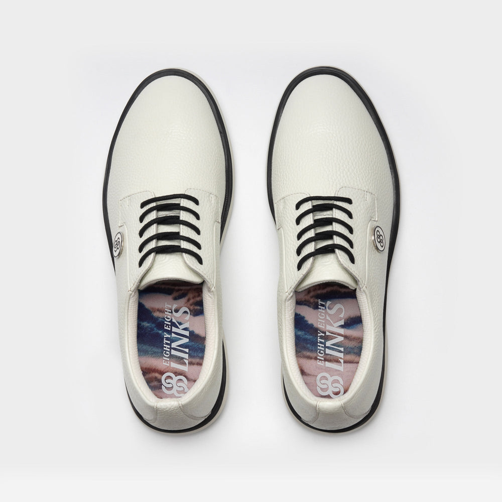 White shoes with black soles on a white background sells at Paradise Golf