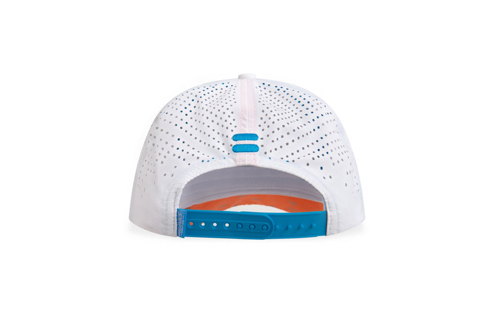 White cap with blue and orange accents on a white background sells at Paradise Golf